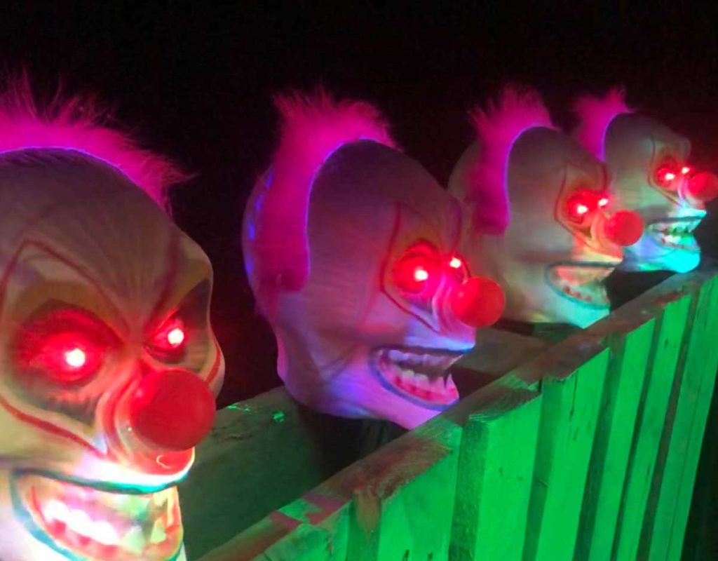 Great Escape in Waxahachie clown masks with glwoing red eyes