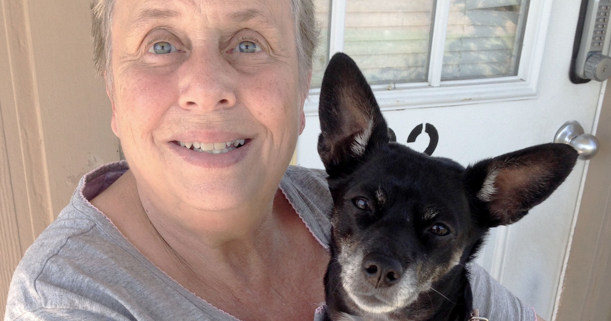 Photo of Ellis County Meals on Wheels client and her dog