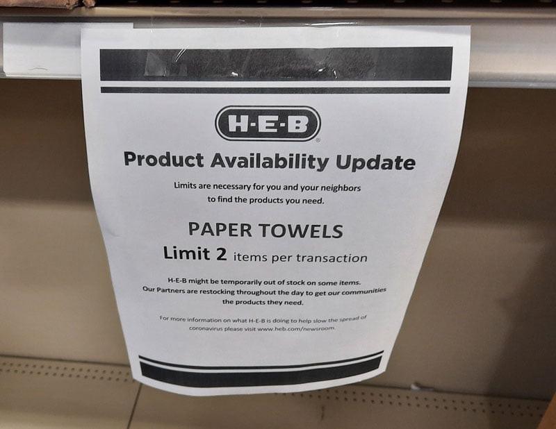 Photo of notice at HEB restricting paper products