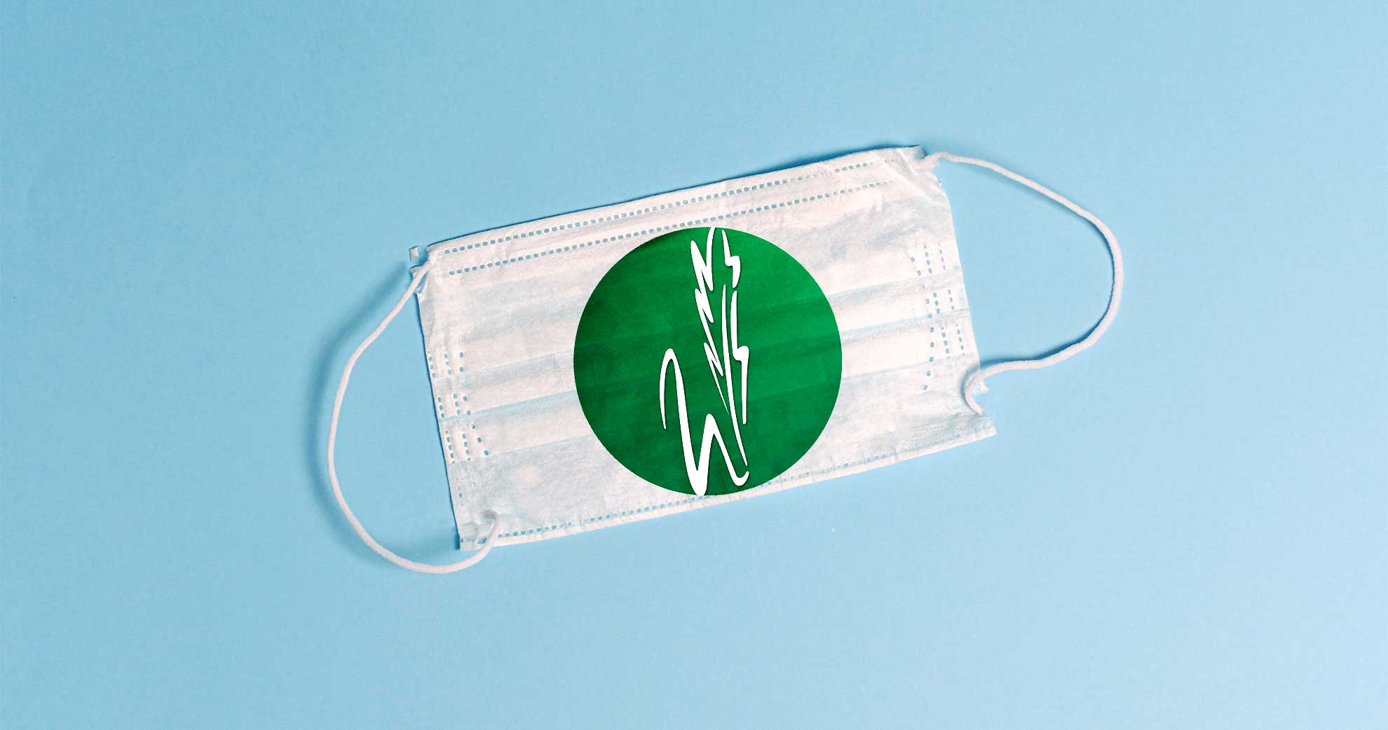 Photo of surgical face mask with waxahachie isd logo on blue background
