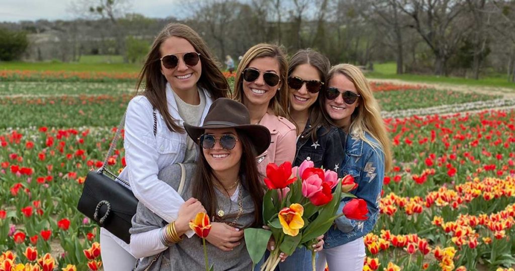 Photo of five in tulip field at Poston Gardens Tulipalooza in Waxahachie Texas