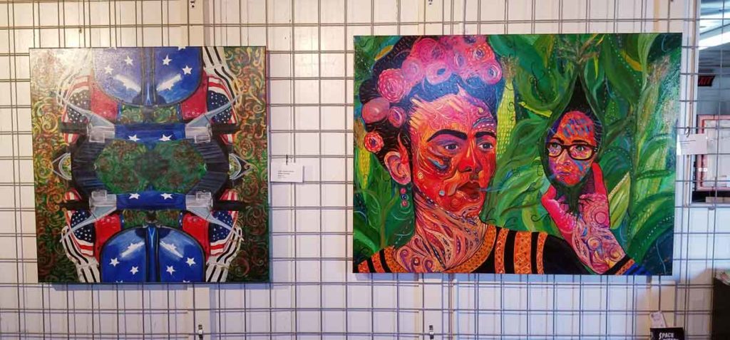 Photo of two paintings on the wall at Glenn's Warehouse Carpets Cultural Center in Waxahachie, Texas