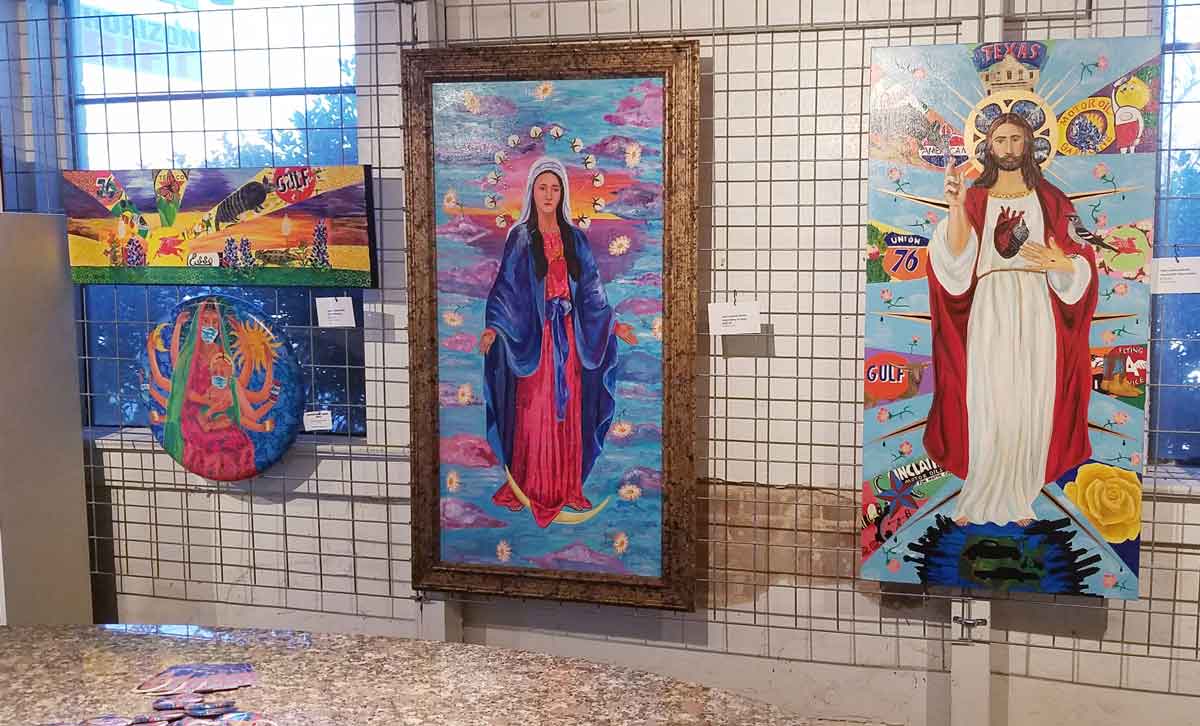 Photo of wall of paintings at Glenn's Warehouse Carpets Cultural Center in Waxahachie, Texas