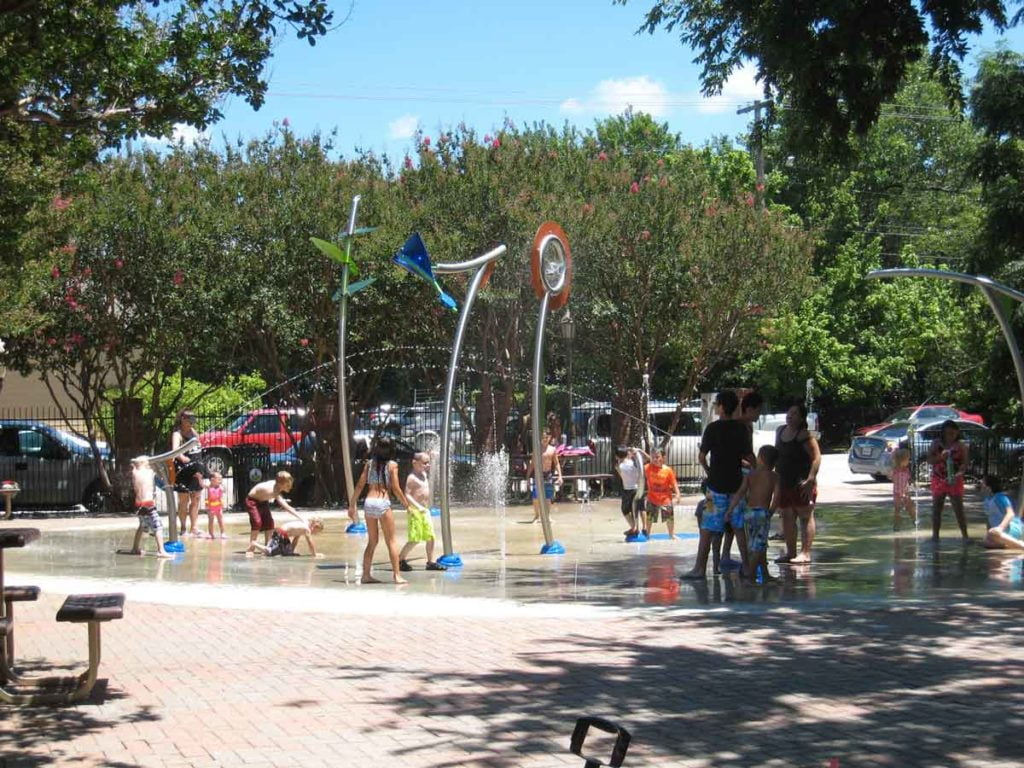 Photo of children playing at a splash pad in Waxahachie, Texas.