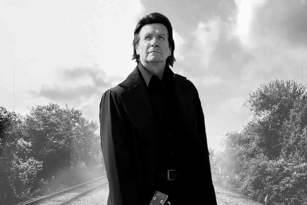 Terry Lee Goffee standing on railroad tracks