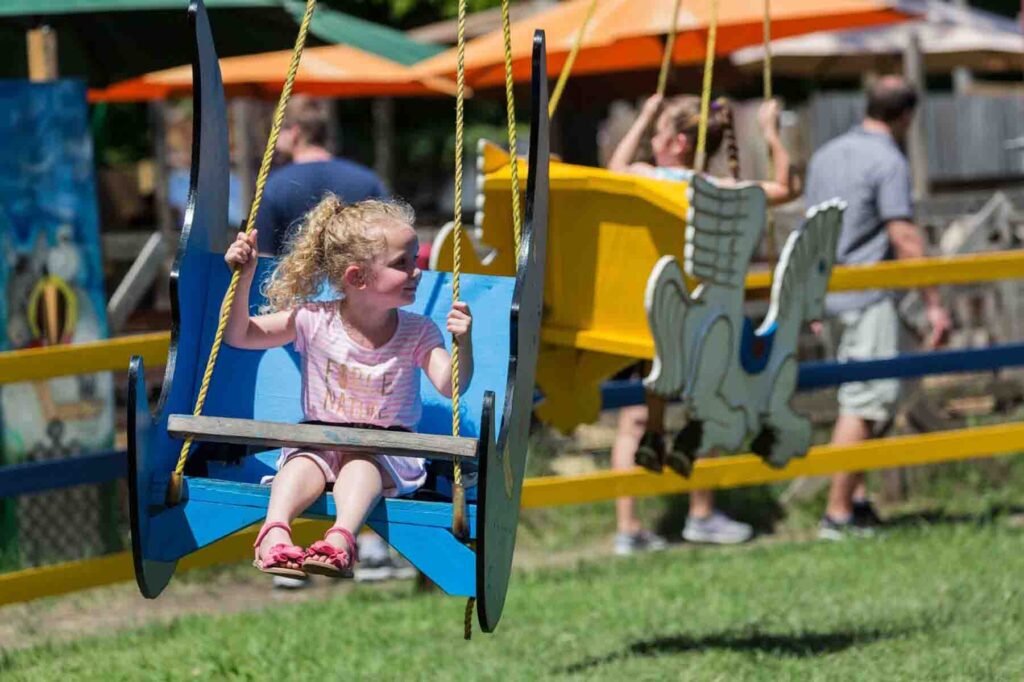 A child and ride at Scarborough Fair in Waxahachie, Texas