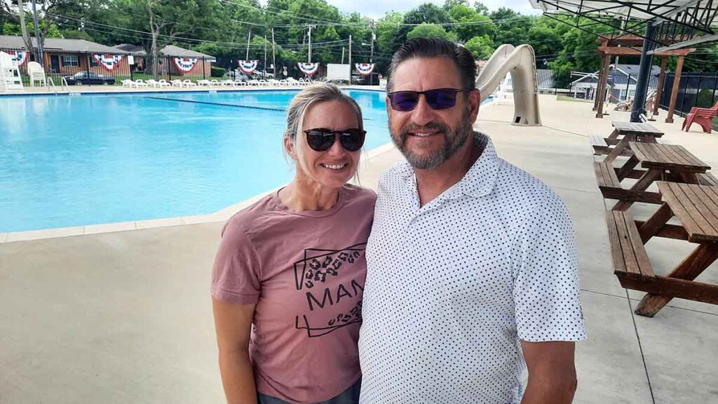 Amber Hill and Bryan Johnson standing before the Optimist Pool in Waxahachie, Texas.