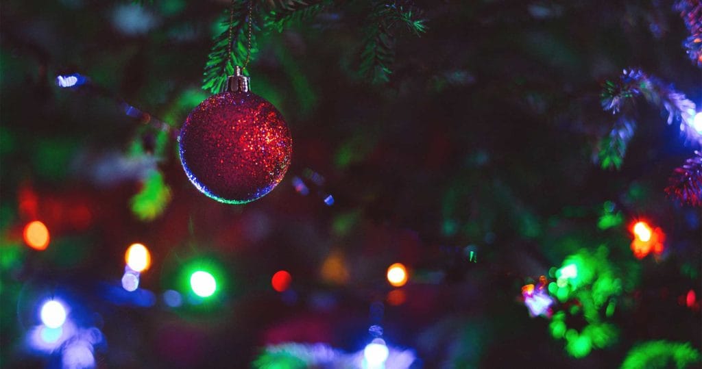 Photo of Christmas lights at night with tree ornament